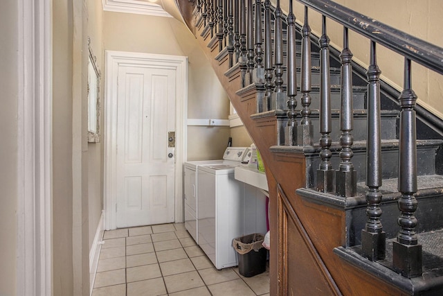 washroom featuring light tile patterned flooring and separate washer and dryer