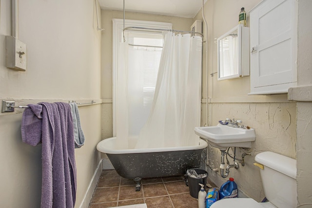 bathroom featuring tile patterned flooring and toilet