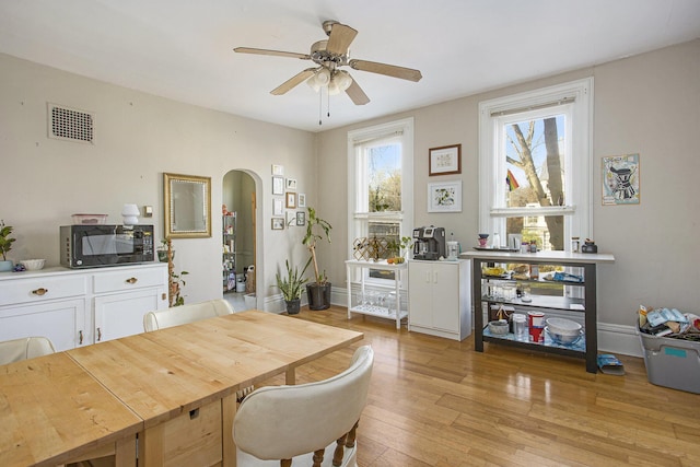 dining space featuring ceiling fan and light hardwood / wood-style floors