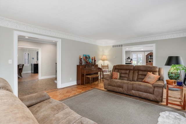 living room featuring parquet flooring and ornamental molding