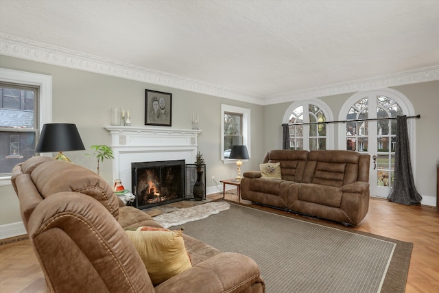 living room featuring ornamental molding and light parquet floors