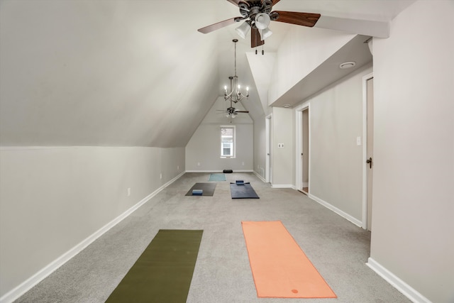 exercise room featuring light carpet, ceiling fan with notable chandelier, and lofted ceiling