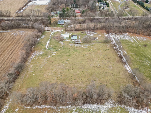 birds eye view of property with a rural view