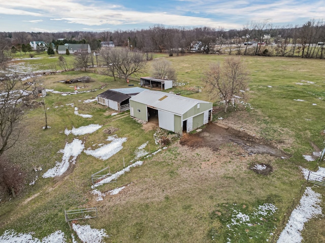 birds eye view of property with a rural view