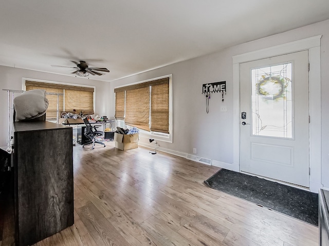 foyer featuring light hardwood / wood-style flooring and ceiling fan