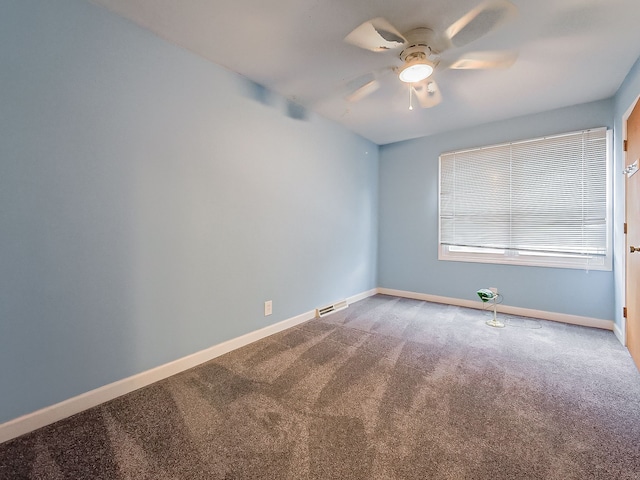 spare room with carpet flooring and ceiling fan