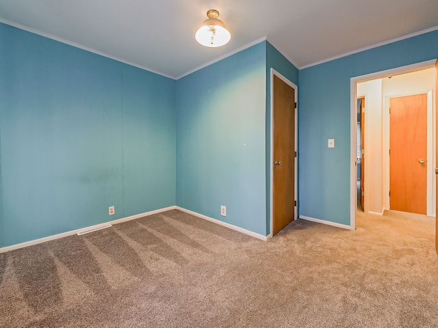 unfurnished bedroom with carpet flooring and ornamental molding