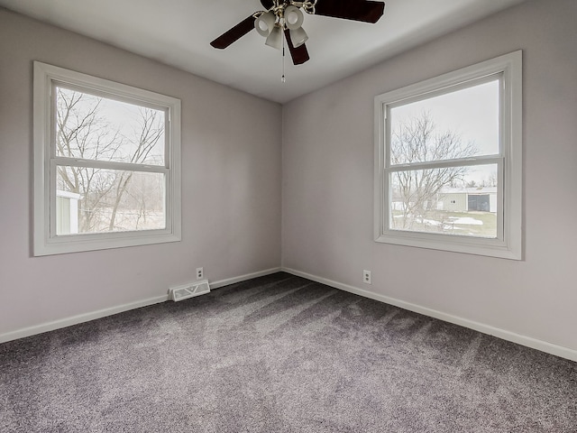 carpeted empty room with ceiling fan