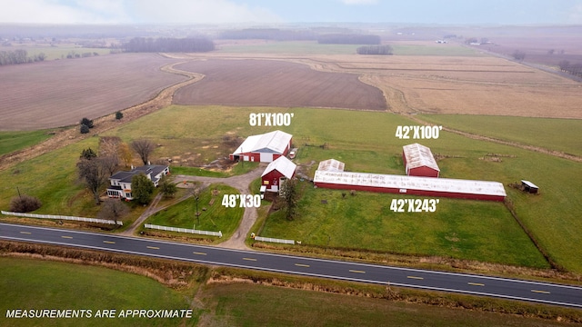 birds eye view of property featuring a rural view