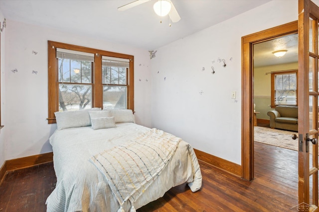 bedroom featuring ceiling fan and dark hardwood / wood-style flooring