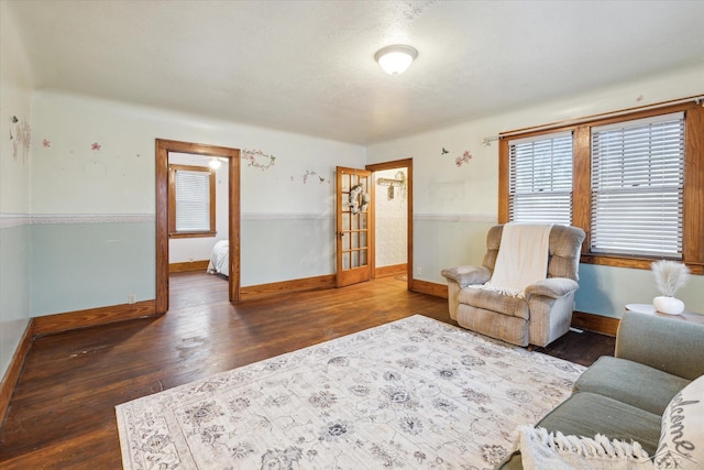 sitting room with dark hardwood / wood-style floors