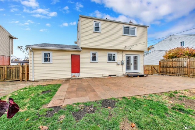 rear view of property with french doors and a patio