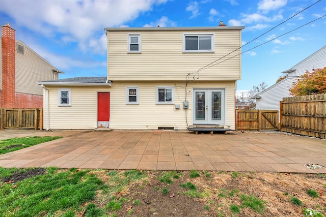 rear view of house featuring french doors and a patio area