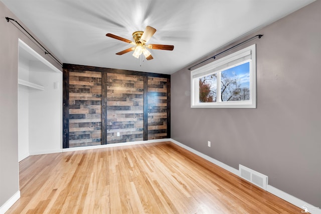 unfurnished room featuring ceiling fan and light hardwood / wood-style floors