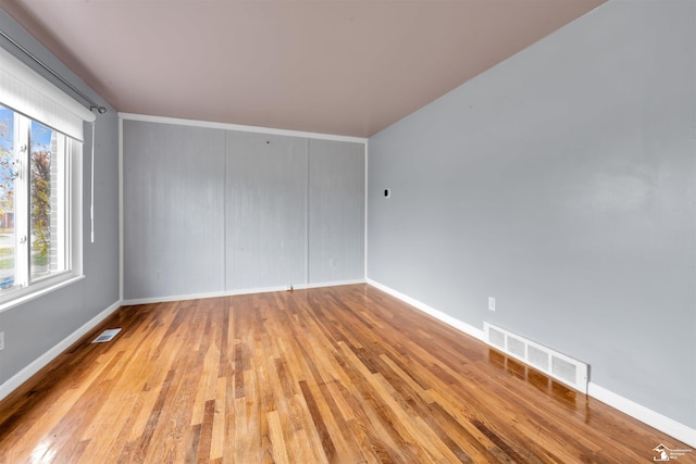 spare room with light wood-type flooring