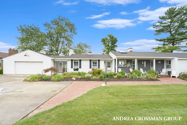 single story home with a front yard, a garage, and covered porch