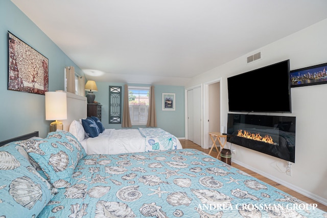 bedroom with hardwood / wood-style floors