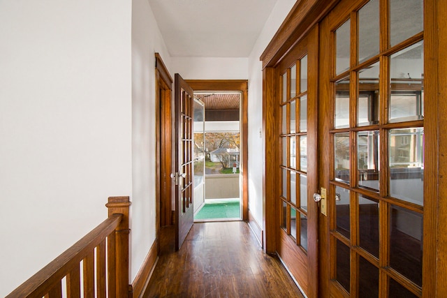 hallway with dark wood-type flooring and french doors