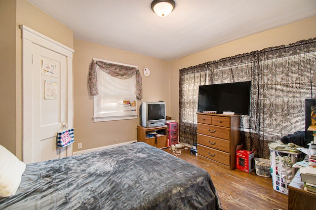 bedroom with hardwood / wood-style flooring