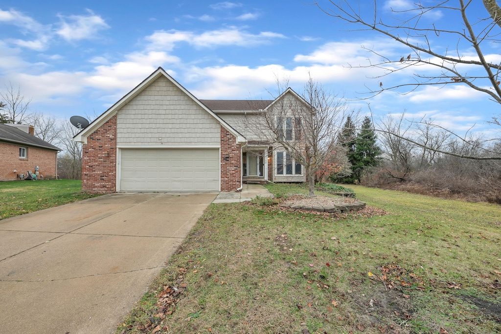 front of property featuring a garage and a front yard