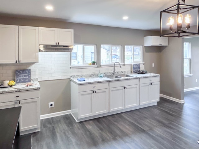 kitchen with white cabinets and dark wood-type flooring