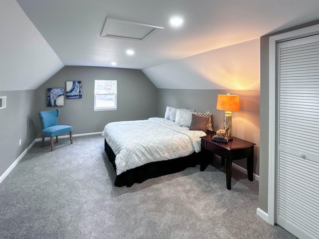 bedroom with carpet and vaulted ceiling