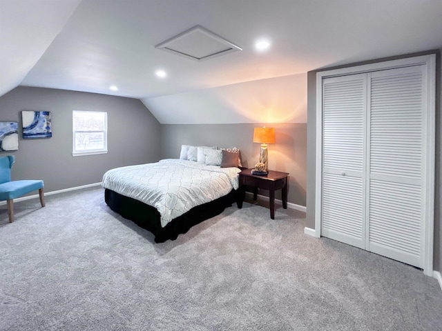 carpeted bedroom featuring vaulted ceiling