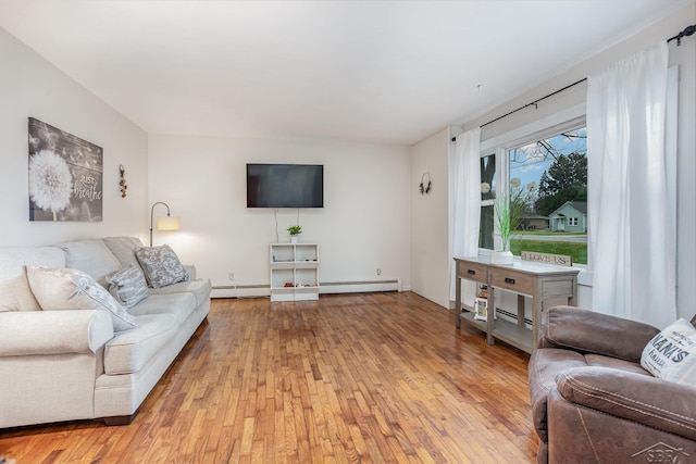 living room featuring light hardwood / wood-style floors and a baseboard radiator