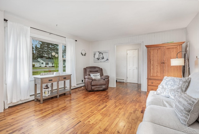 living room featuring light hardwood / wood-style floors and baseboard heating