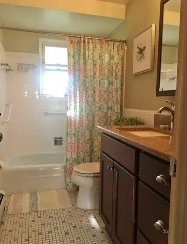 full bathroom with tile patterned floors, vanity, toilet, and shower / bathtub combination with curtain