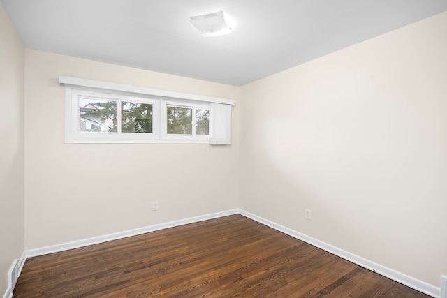 empty room featuring dark wood-type flooring