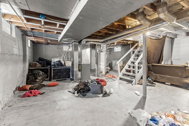 basement featuring gas water heater and heating unit