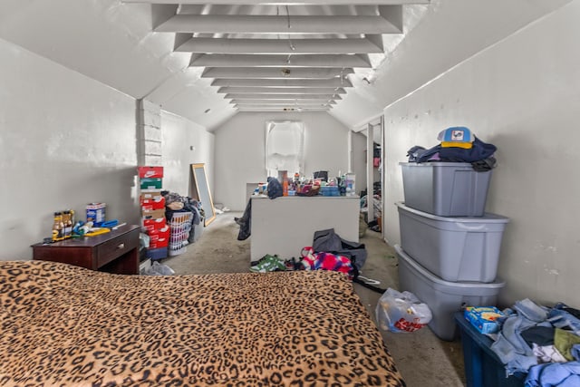 bedroom with carpet flooring and lofted ceiling