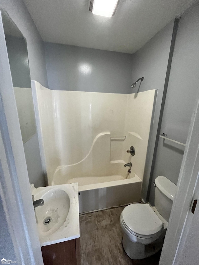 full bathroom with shower / washtub combination, vanity, and toilet