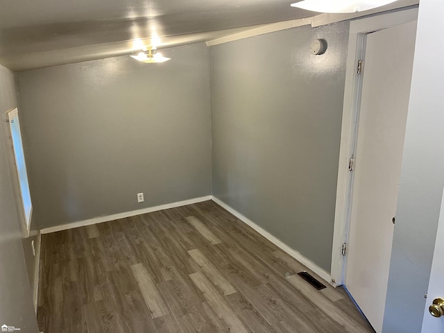 spare room featuring hardwood / wood-style flooring