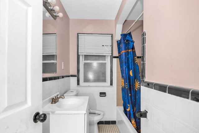 full bathroom featuring vanity, toilet, tile walls, and shower / bath combo