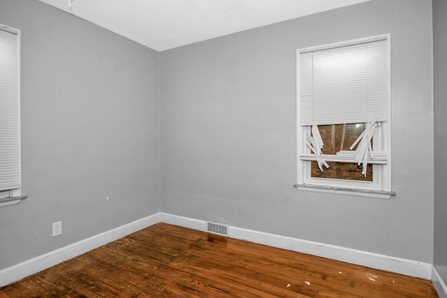 empty room with wood-type flooring