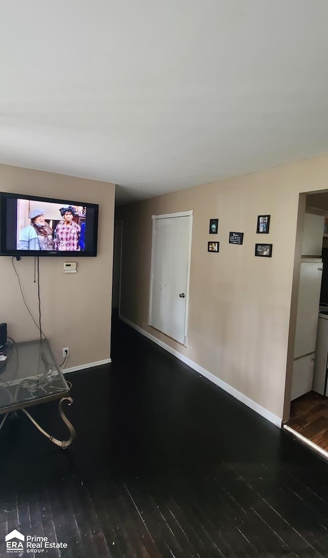 unfurnished living room featuring hardwood / wood-style flooring