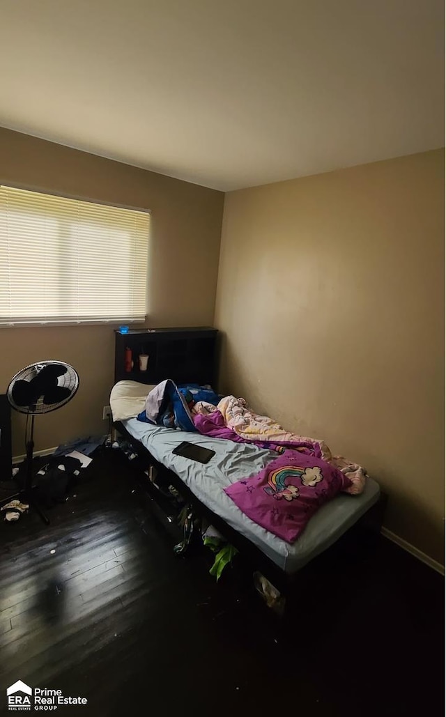 bedroom featuring hardwood / wood-style flooring