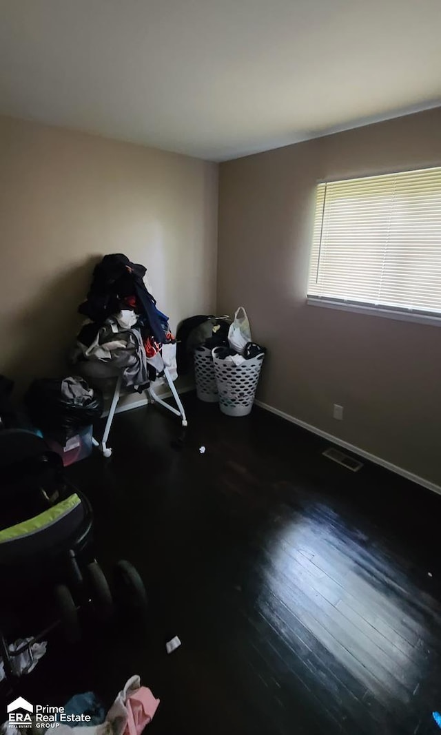 miscellaneous room with wood-type flooring