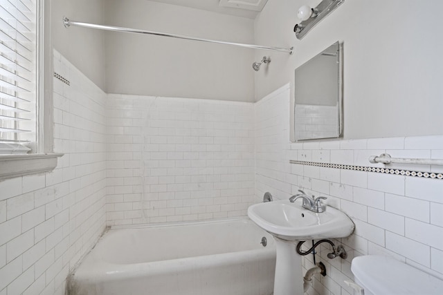 1055 Philip St, Detroit, MI 48215 - bathroom featuring tile walls, toilet, and shower / tub combination