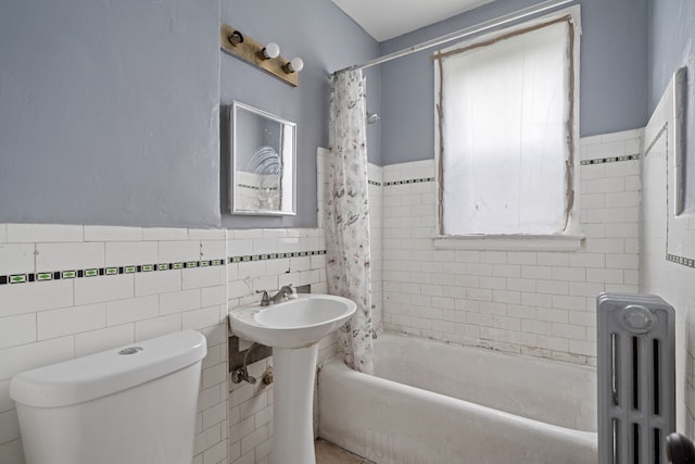 bathroom featuring radiator, shower / bathtub combination with curtain, tile walls, and toilet