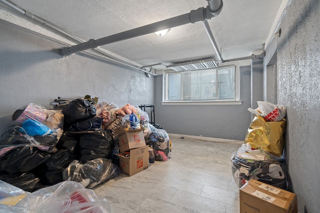 basement featuring a textured ceiling