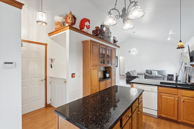 kitchen featuring a center island, white dishwasher, sink, decorative light fixtures, and light hardwood / wood-style floors