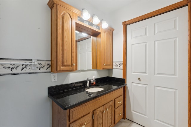 bathroom with tile patterned flooring and vanity