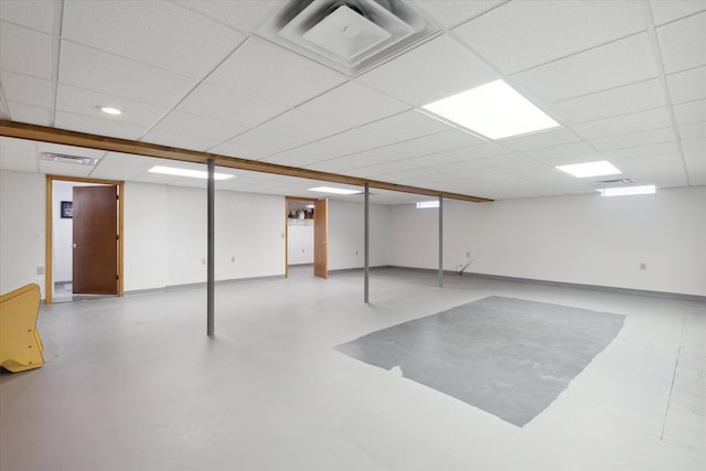 basement featuring a paneled ceiling