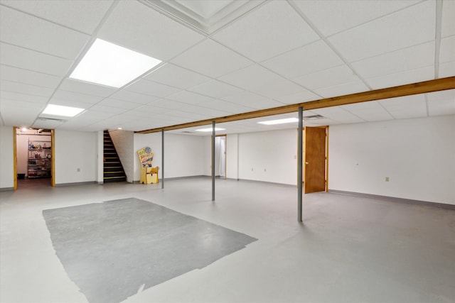 basement featuring a paneled ceiling