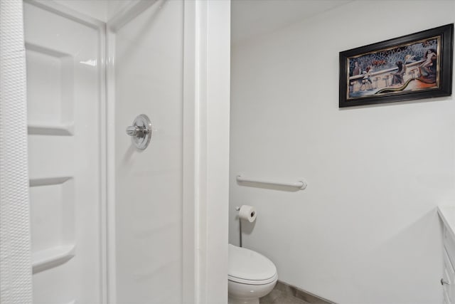 bathroom featuring toilet and a shower