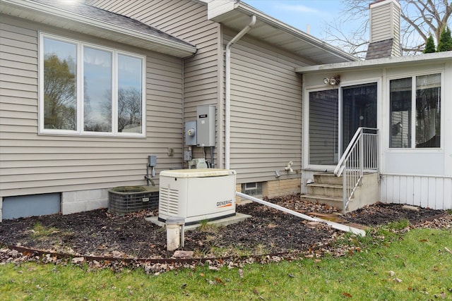 exterior space featuring central AC and a sunroom