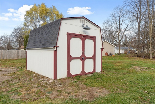 view of outbuilding with a lawn